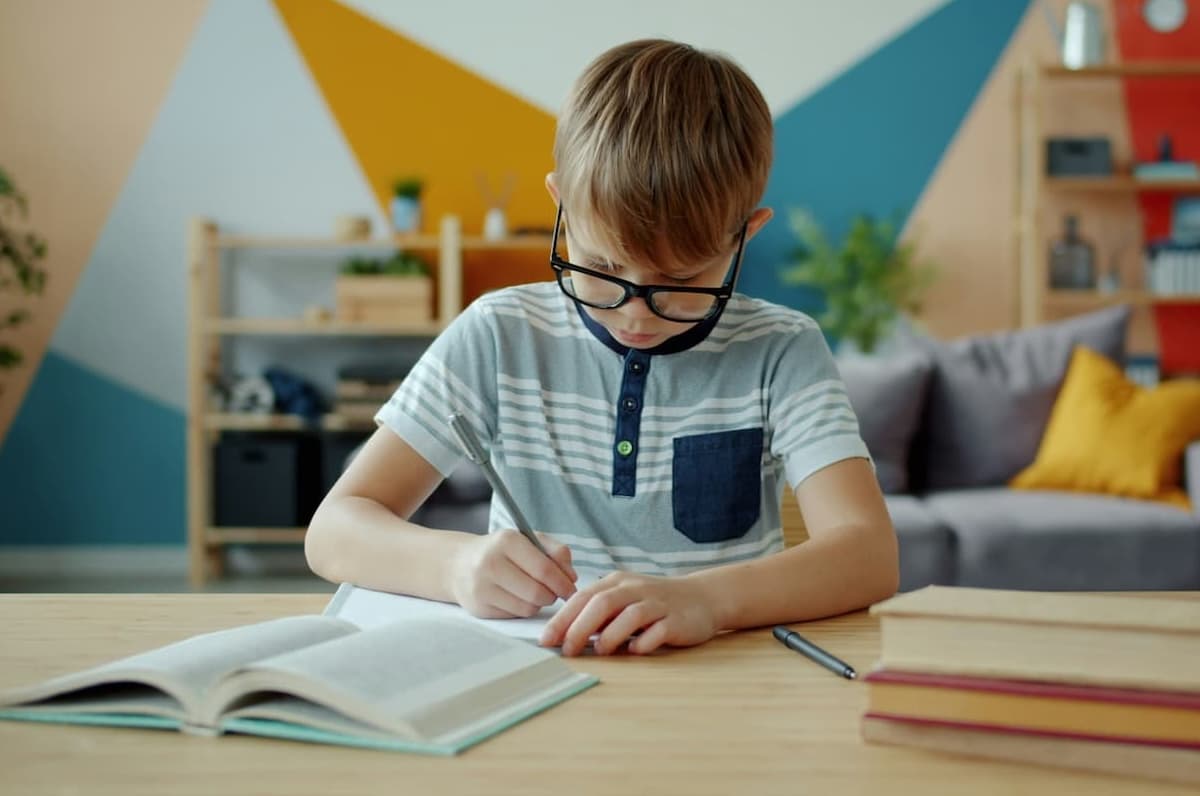 A young person working at a desk in a calm, focused environment