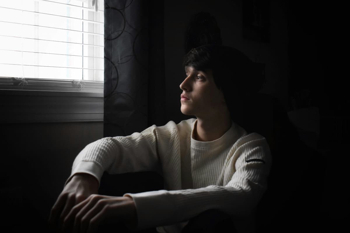 A young person in a calm, private space