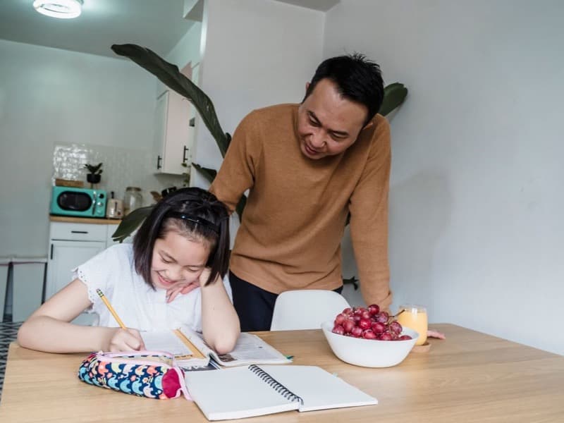 A young person slowly re-engaging with school, supported by a clinician