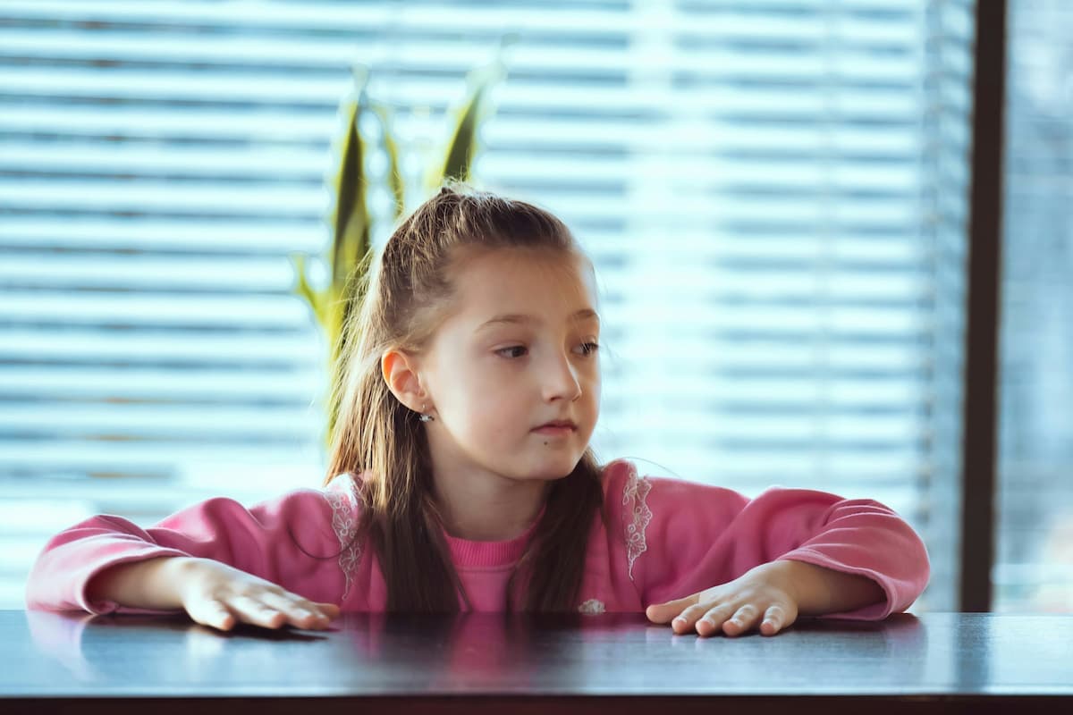 A clinician meeting with a young person and parent