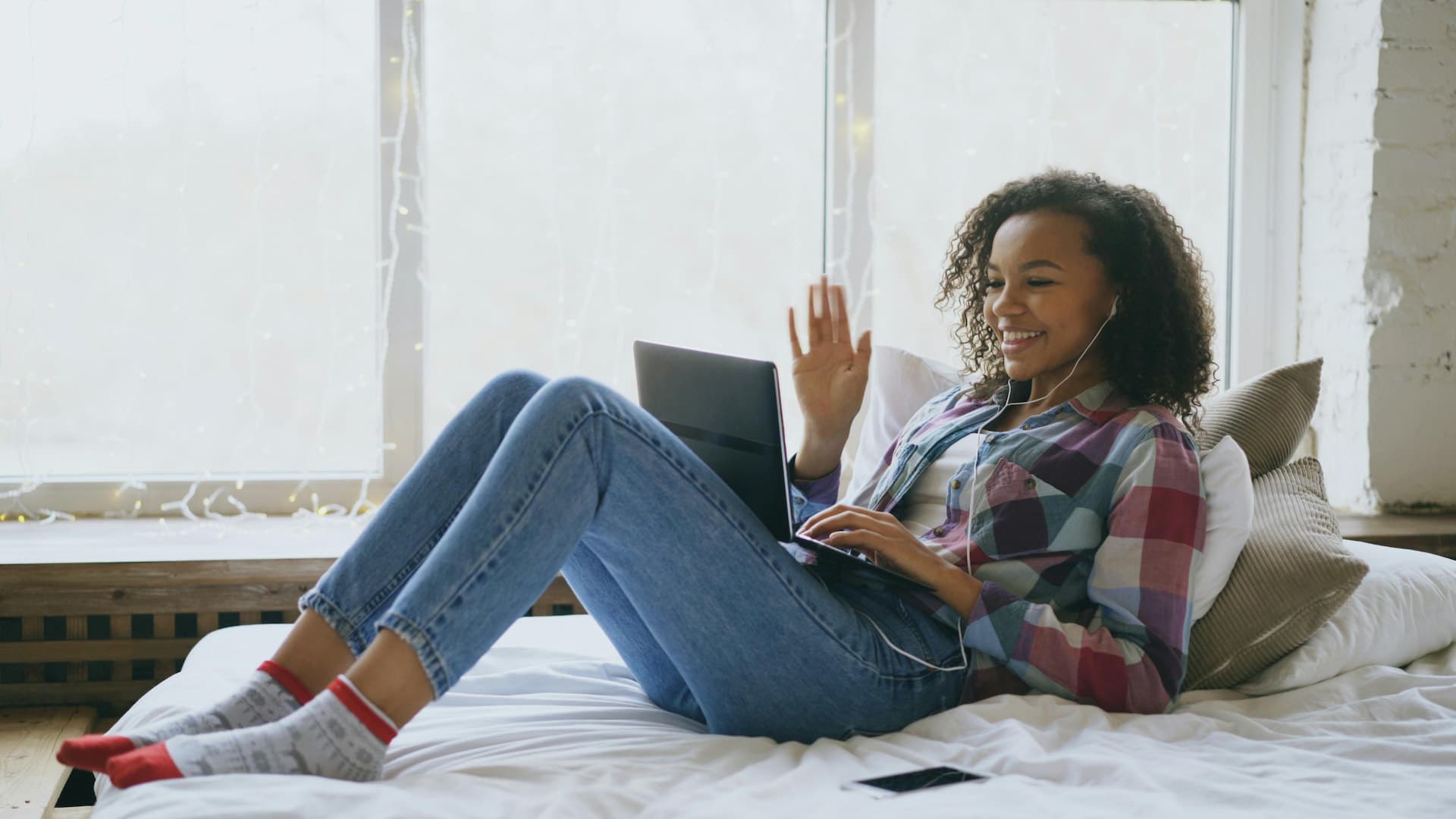 A young person in a therapy session from the comfort of home