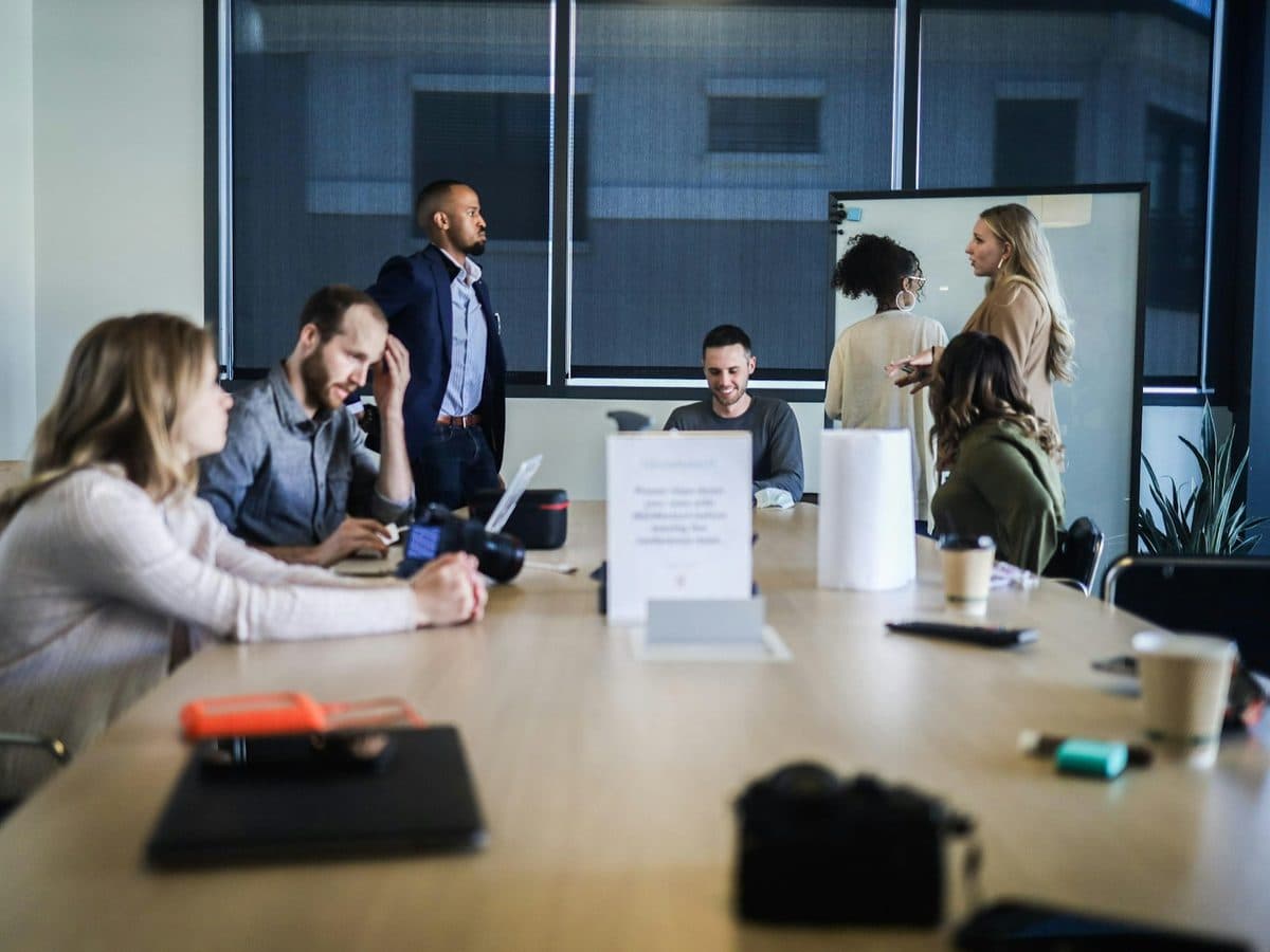 People seated around a meeting table