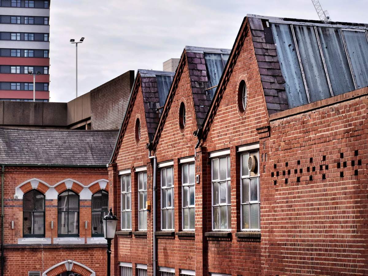 The red brick gables of a Victorian school building