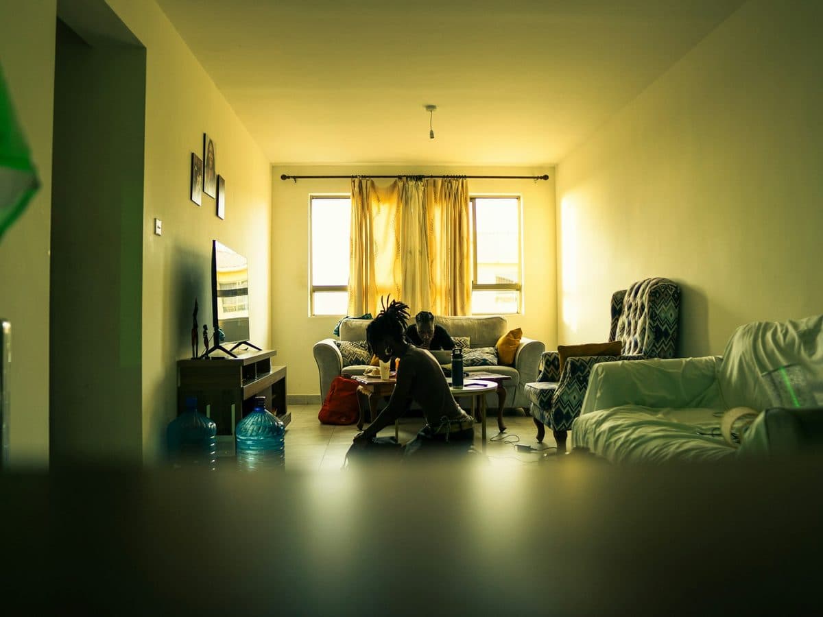 People together in a living room in warm light