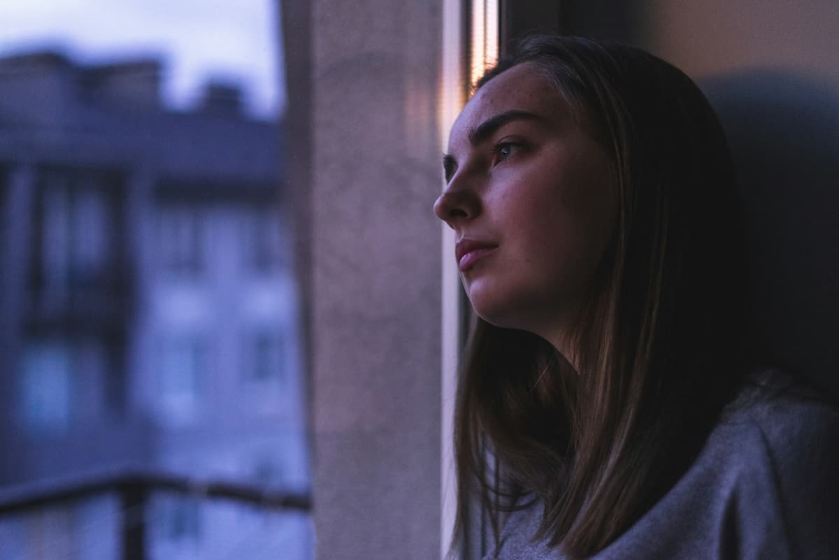 A young adult in a calm, private space